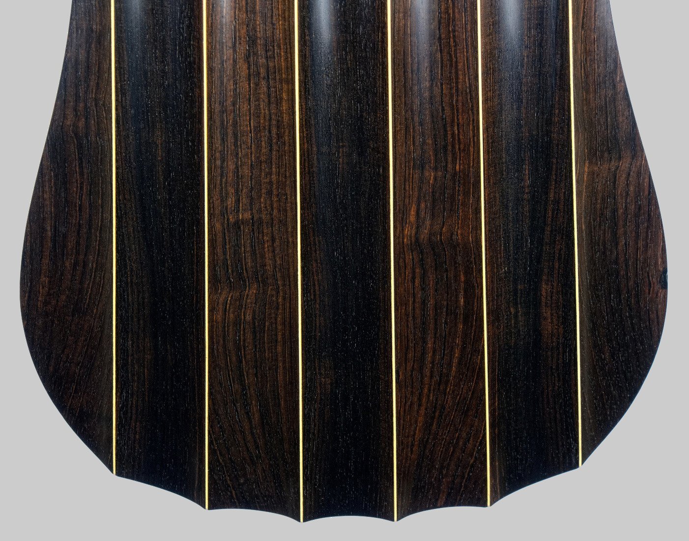 Fluted ribs in african blackwood at lower bout of  body